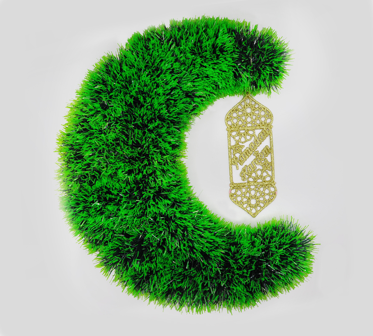 Ramadan Decorations Hanging From Artificial Grass In The Shape Of Ramadan Crescent