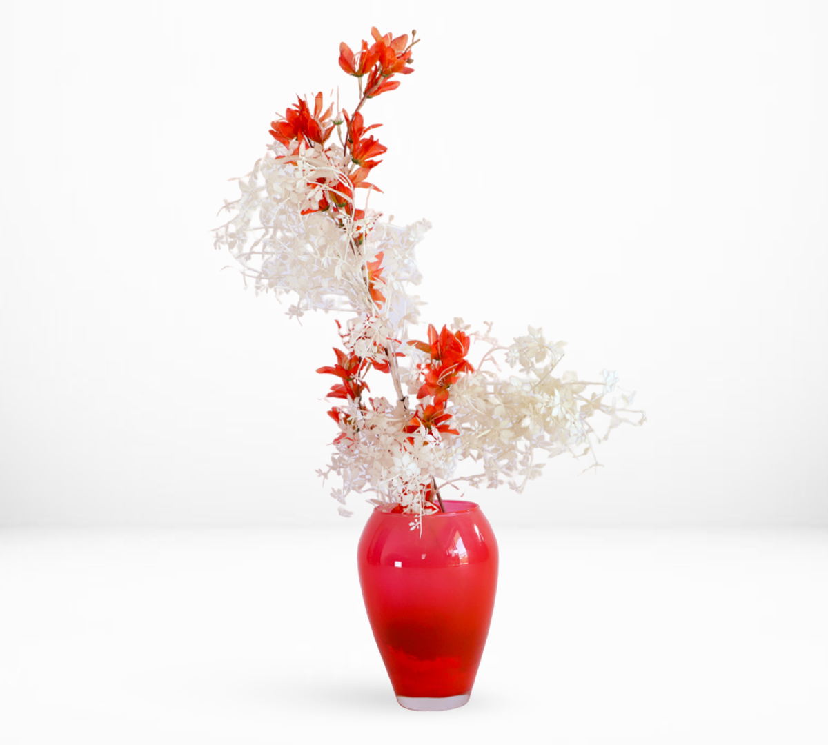 A Colored Glass Decorative Vase Filled With Artificial Flowers - Hand Arranged
