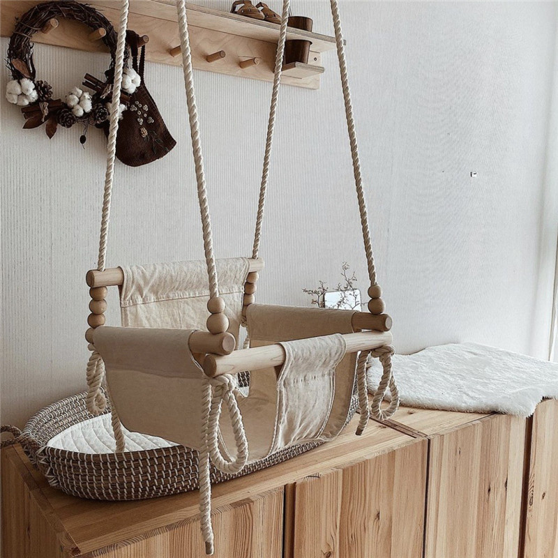 A swing for children in indoor and outdoor places with a safety belt, a cloth swing