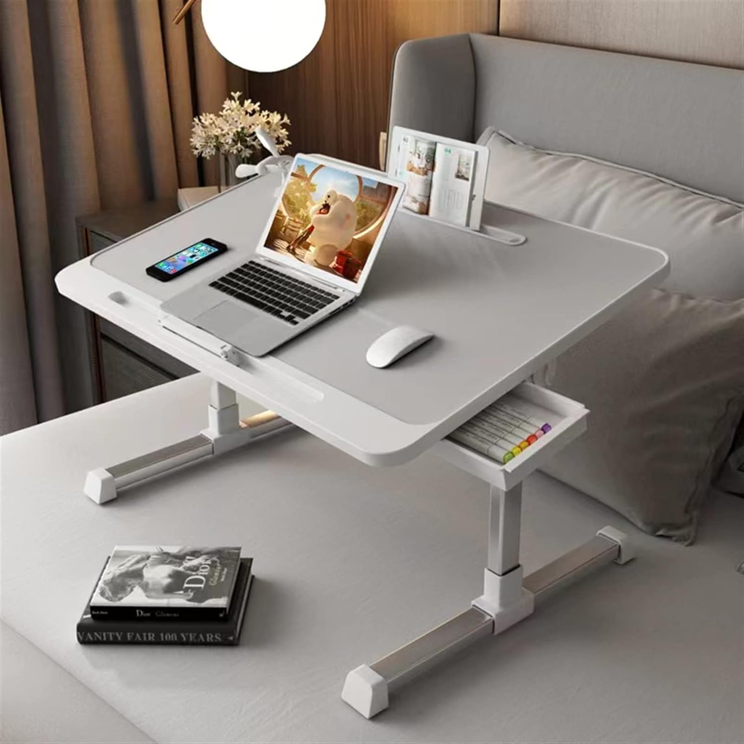 A small mobile desk on the bed, white, for multi-use