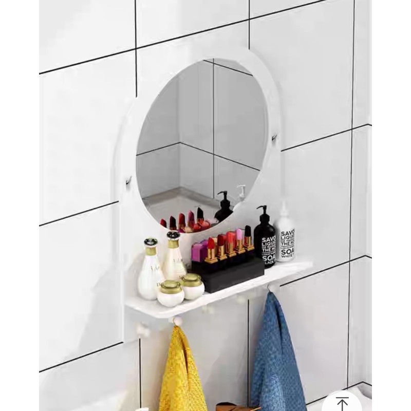 Circular bathroom mirror with shelf and hangers for bathrobes