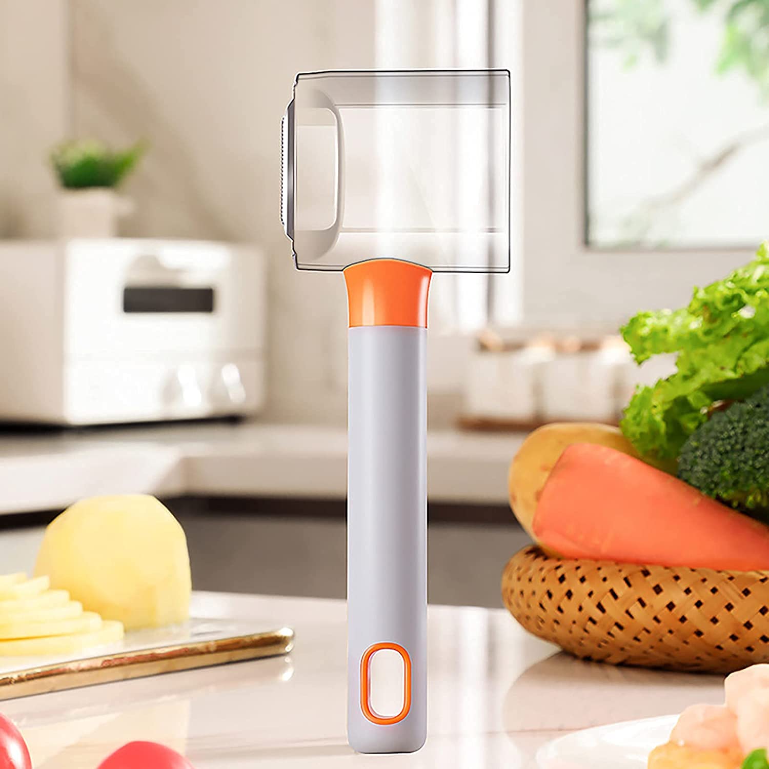 Vegetable and fruit peeler with long handle and equipped with a storage tank for peels